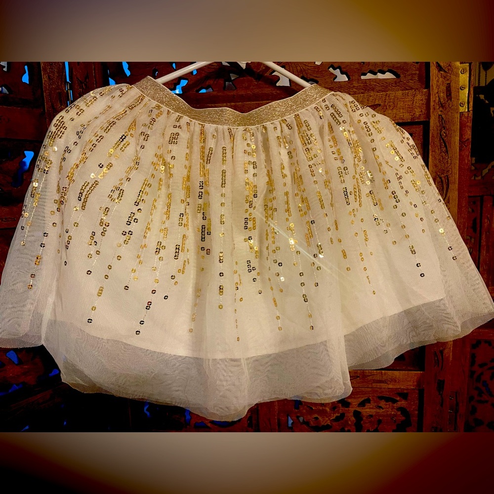 Cream tutu with gold sequence. Perfect for holidays.